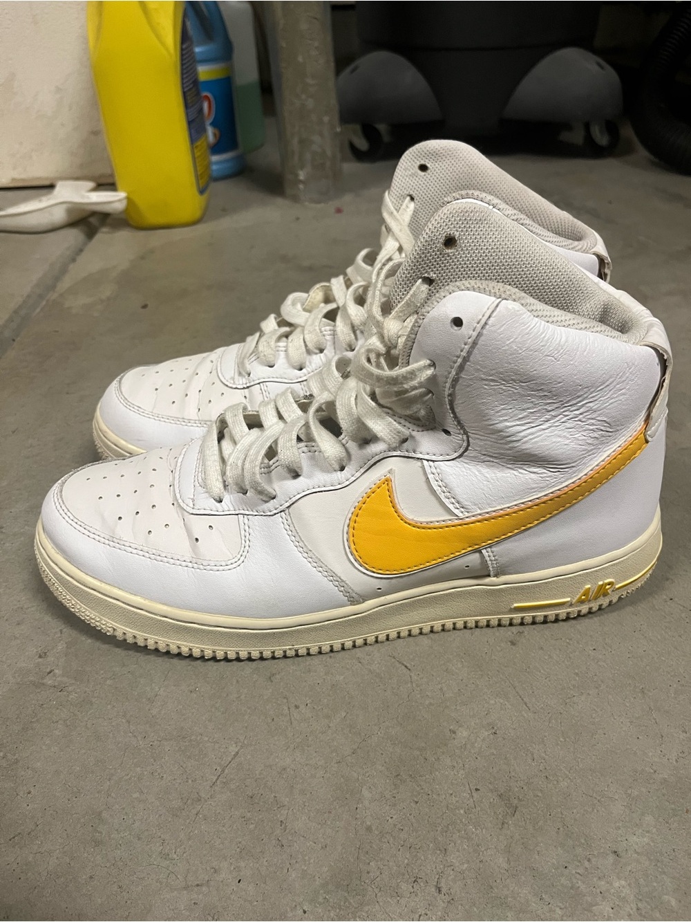 Nike White High-Top Sneakers with Yellow Swoosh Accent